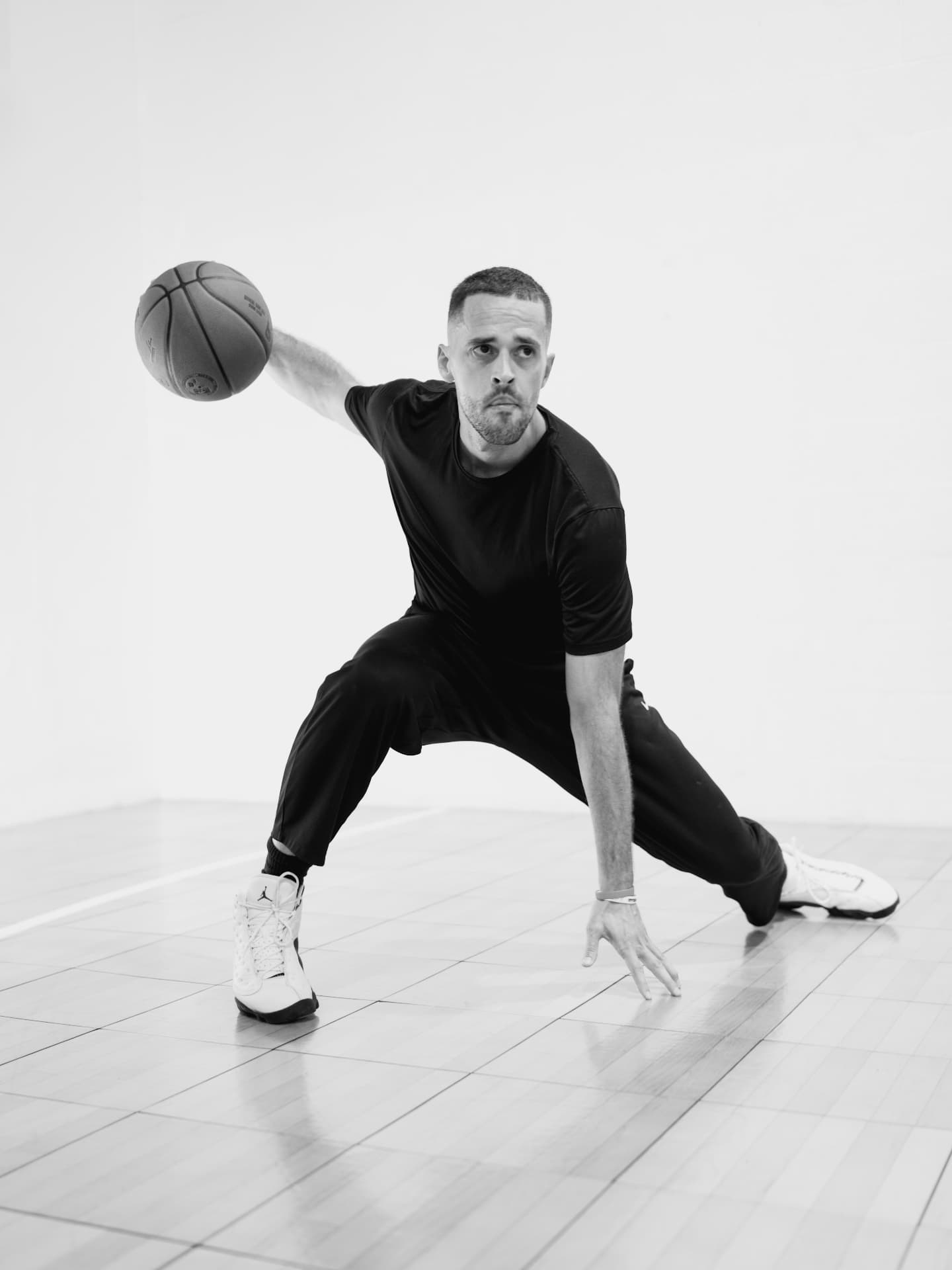 Coach Carlos handling a basketball on an outdoor private court